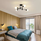 Coblitz 4 Light Sputnik Chandelier by TheChandelierCo featuring a modern starburst design with four exposed bulbs.