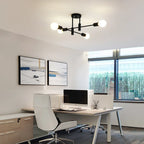 Coblitz 4 Light Sputnik chandelier by TheChandelierCo featuring a modern metal design with four exposed bulbs on a round frame.
