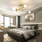 Coblitz 4 Light Sputnik Chandelier by TheChandelierCo with four exposed bulbs and a modern metallic finish.