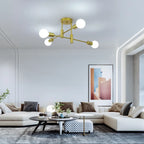 Coblitz 4 Light Sputnik Chandelier by TheChandelierCo featuring a modern starburst design with four exposed bulbs and a sleek metal finish.