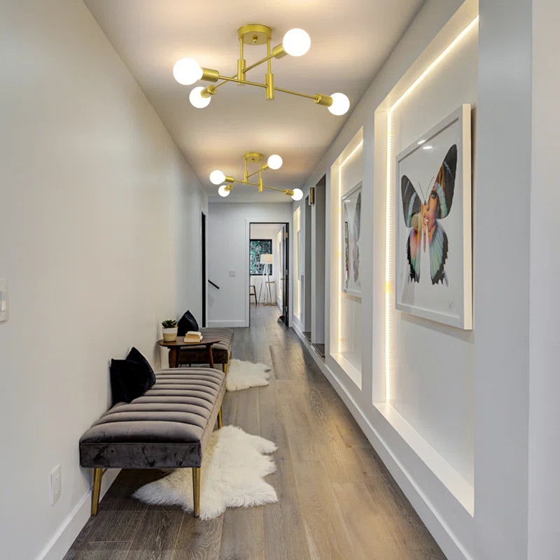 Coblitz 4 Light Sputnik chandelier by TheChandelierCo featuring a modern metallic finish and four exposed bulb sockets.