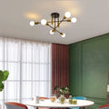 Coblitz 6-light Sputnik semi-flush mount chandelier with a 62cm diameter, featuring modern metal arms and glass globe bulbs.