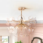 Dandelion 4-light glass starburst sunburst ceiling light by TheChandelierCo, semi-flush mount with clear glass globes and starburst design.
