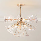 Dandelion 4-light glass starburst sunburst ceiling light by TheChandelierCo, semi-flush mount with clear glass globes and metal arms.