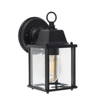 Black outdoor wall lantern by TheChandelierCo, featuring a classic design with glass panels and decorative metalwork.