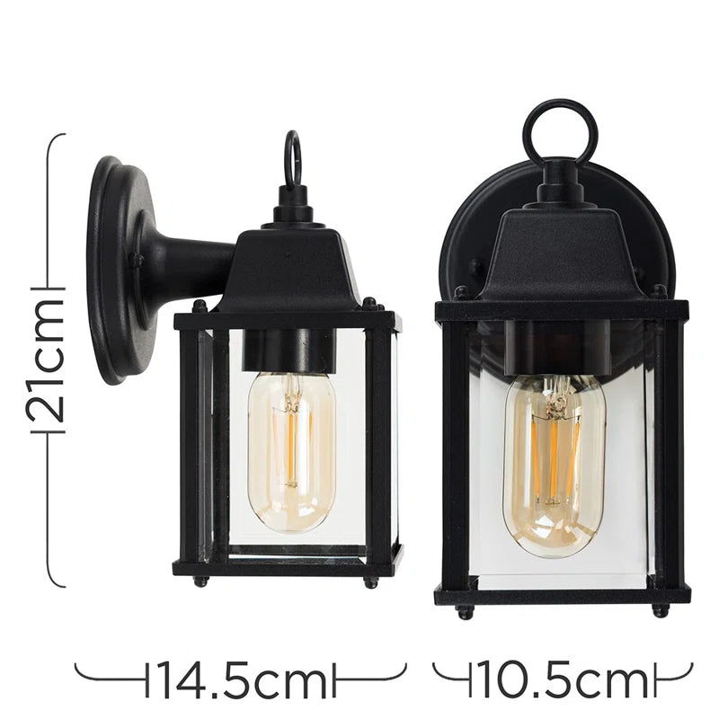 Black outdoor wall lantern by TheChandelierCo with classic design, mounted on a wall, ideal for exterior lighting.