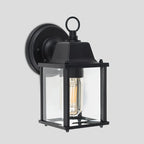 Black outdoor wall lantern by TheChandelierCo, featuring a classic design with clear glass panels and decorative metal details.