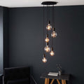 Drishya 6 light cluster pendant by TheChandelierCo featuring six hanging pendant lights with modern design and sleek finish.