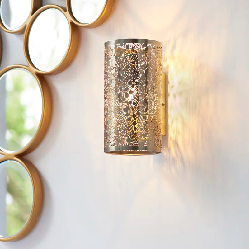 Set of two Edie Steel Flush Mounted Sconces by TheChandelierCo featuring sleek, modern design with circular wall mounts and soft ambient lighting.