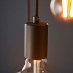 Drishya 6 light cluster pendant by TheChandelierCo featuring six elegant hanging light fixtures with modern design.