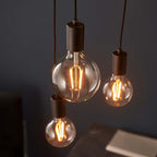 Drishya 6 Light Cluster Pendant by TheChandelierCo featuring six elegant hanging lights with a modern design.