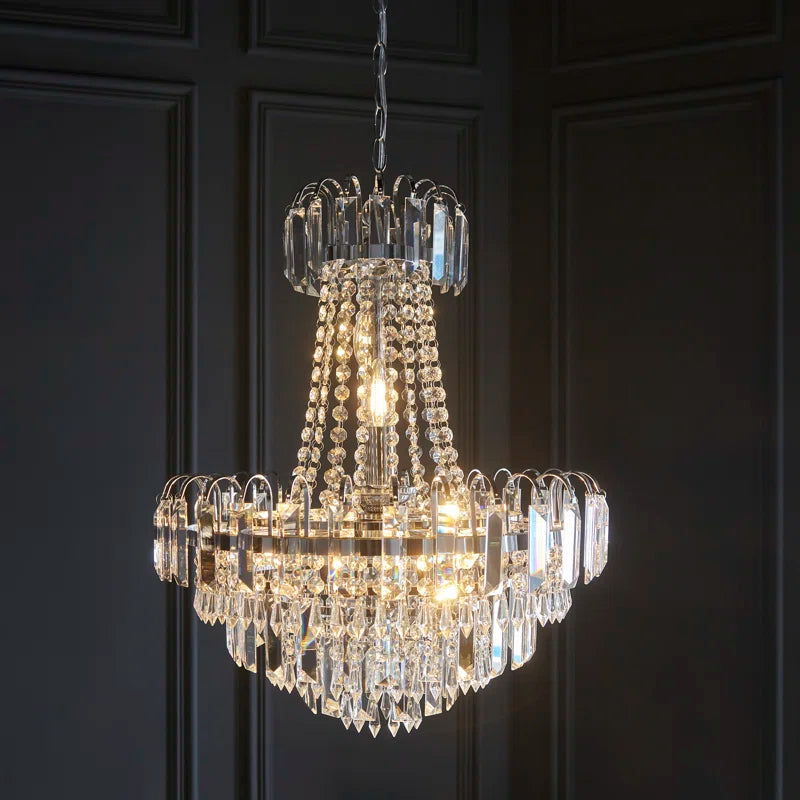Elegant Jayla 6 light chandelier by TheChandelierCo featuring a sleek modern design with six illuminated glass shades.