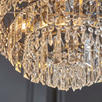 Elegant Jayla 6 light chandelier by TheChandelierCo featuring a modern design with six curved light fixtures and a sleek finish.