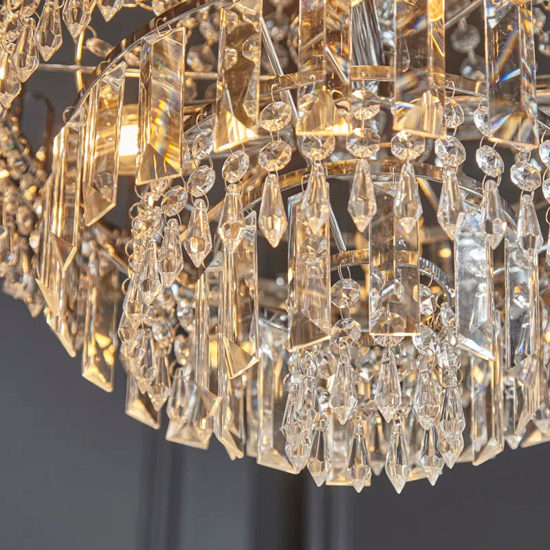 Elegant Jayla 6 light chandelier by TheChandelierCo featuring a modern design with six curved light fixtures and a sleek finish.