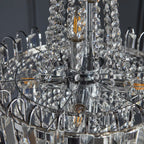 Elegant Jayla 6 light chandelier by TheChandelierCo featuring a modern design with six hanging lights and a sleek metal frame.