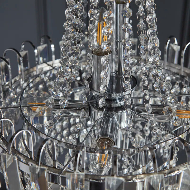 Elegant Jayla 6 light chandelier by TheChandelierCo featuring a modern design with six hanging lights and a sleek metal frame.
