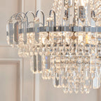 Elegant Jayla 6-light chandelier by TheChandelierCo featuring a modern design with six illuminated glass shades.