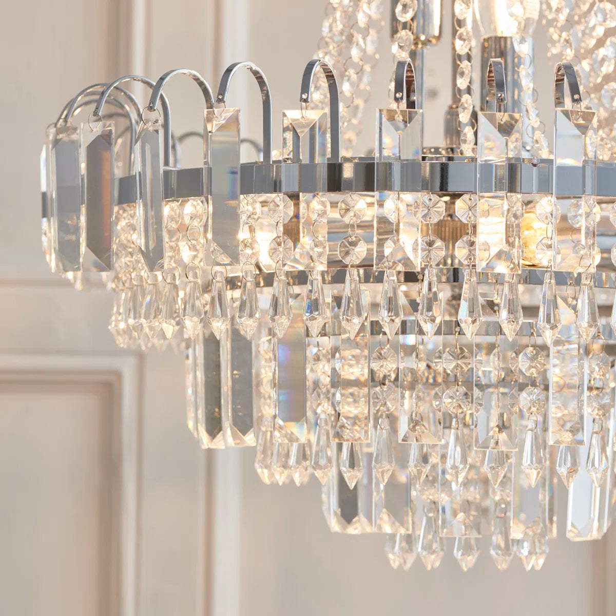 Elegant Jayla 6-light chandelier by TheChandelierCo featuring a modern design with six illuminated glass shades.