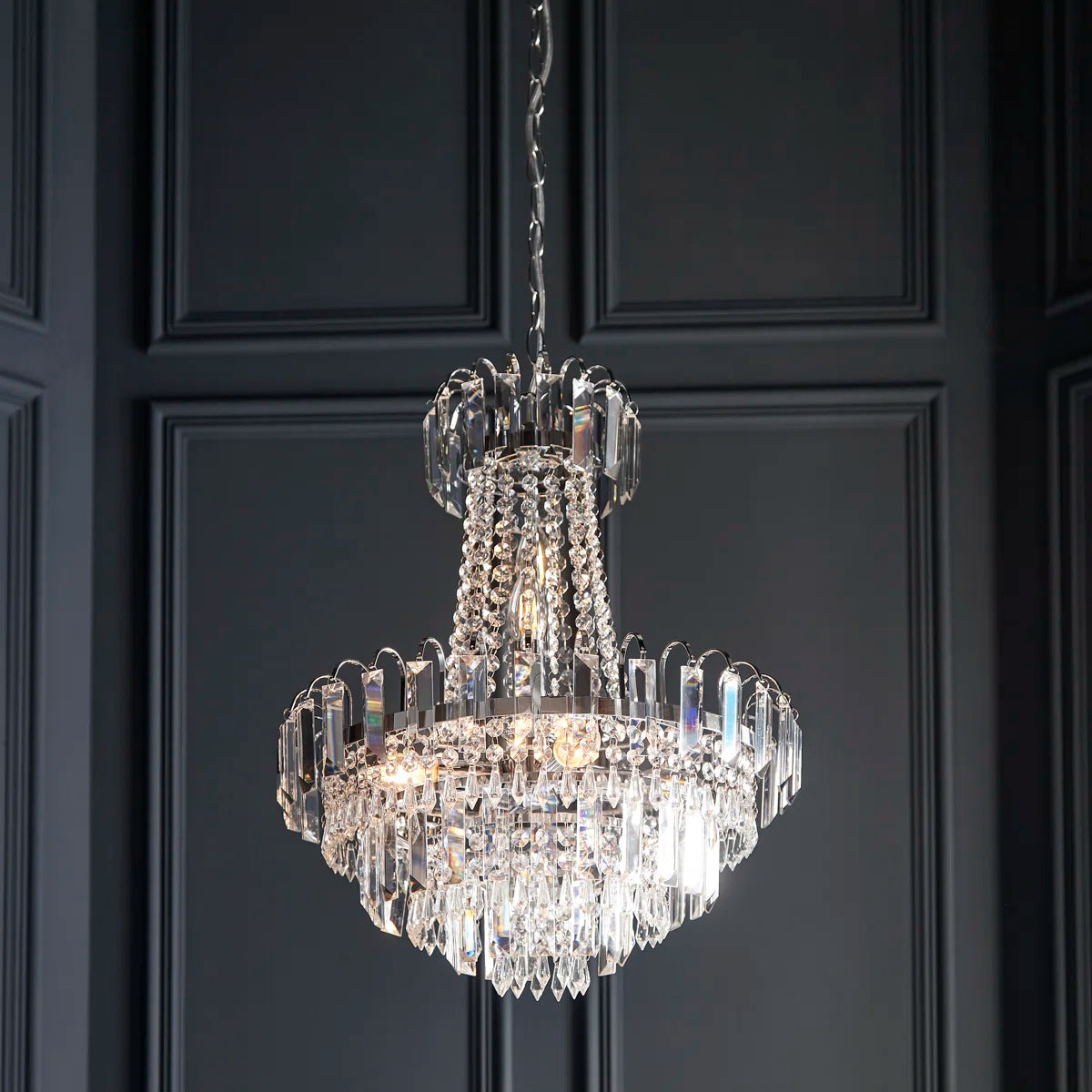 Elegant Jayla 6 light chandelier by TheChandelierCo featuring a modern design with multiple light fixtures and sleek metal finish.
