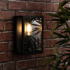 Black outdoor flush mount light fixture by TheChandelierCo, featuring a sleek, modern design with durable metal construction.
