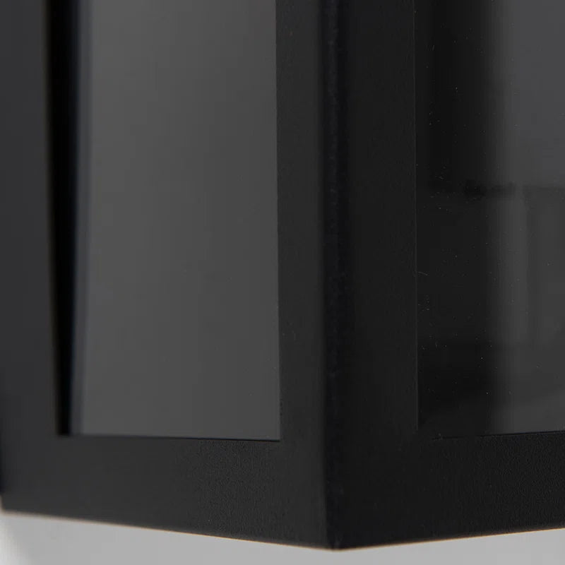 Black outdoor flush mount light fixture by TheChandelierCo, featuring a sleek modern design suitable for exterior lighting.