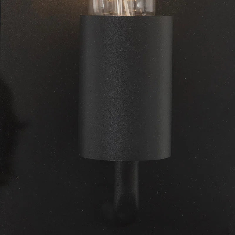 Black outdoor flush mount light fixture by TheChandelierCo featuring a sleek, modern design for exterior lighting.
