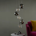 Kensley 6 light chrome cluster pendant light fixture with six hanging pendant lights arranged in a modern design.