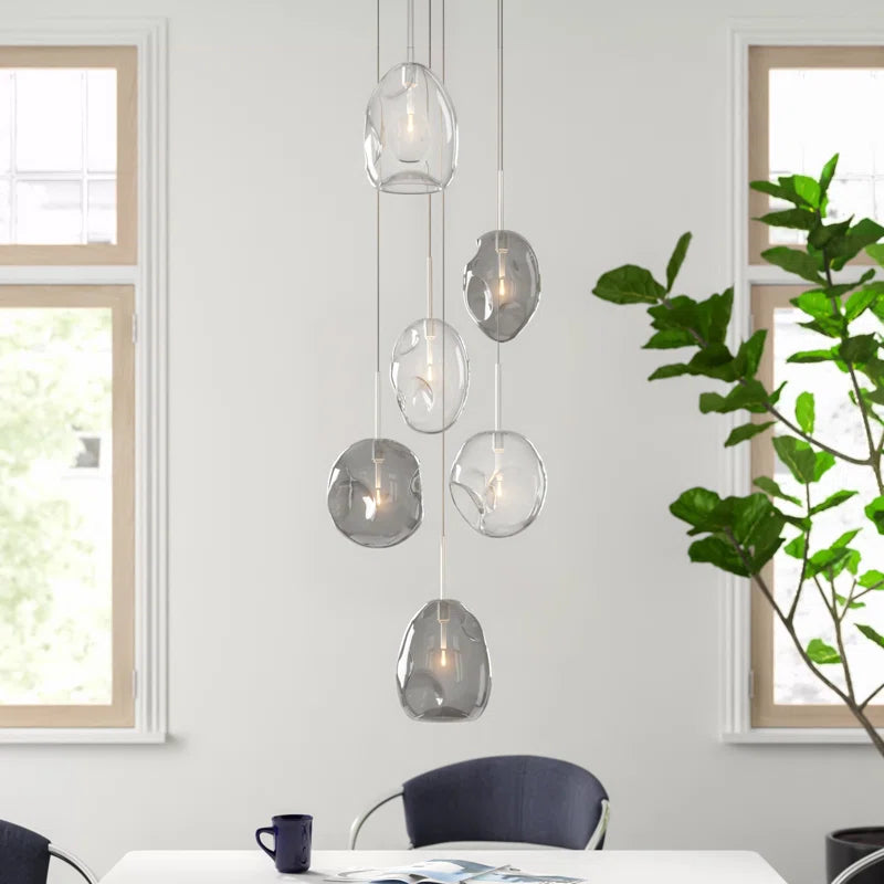 Kensley 6 light chrome cluster pendant light fixture with multiple hanging bulbs and sleek modern design.