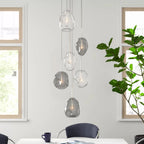 Kensley 6 light chrome cluster pendant light fixture with multiple hanging bulbs and sleek modern design.