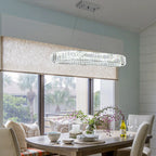 Light crystal LED chandelier by TheChandelierCo, showcasing elegant hanging crystal strands and modern lighting design.