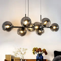 LED pendant chandelier with 8 glass lights, E27 bulbs, height-adjustable design, Lailah model by TheChandelierCo, 105cm tall.