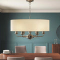 Landover 6 light drum chandelier by TheChandelierCo featuring a sleek drum shade and modern lighting design.