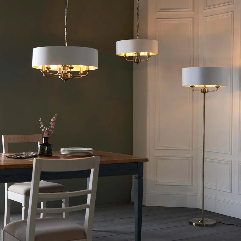 Landover 6 light drum chandelier by TheChandelierCo featuring a modern drum shade with six lights and sleek metal accents.
