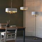 Landover 6 light drum chandelier by TheChandelierCo featuring a modern drum shade with six lights and sleek metal accents.