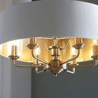 Landover 6 light drum chandelier by TheChandelierCo with a sleek drum shade and modern design hanging from a ceiling mount