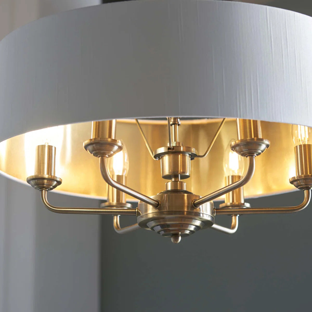 Landover 6 light drum chandelier by TheChandelierCo with a sleek drum shade and modern design hanging from a ceiling mount