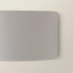 Ceramic flush mounted sconce by TheChandelierCo featuring a sleek, modern design with warm lighting and a smooth finish.