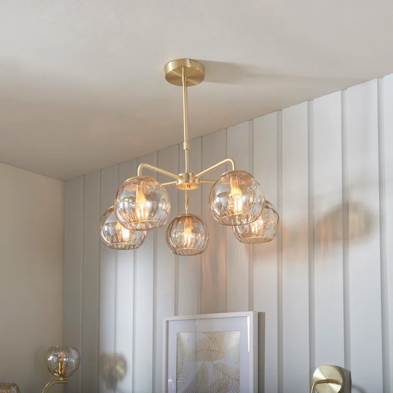 Elegant Litchford 5-light chandelier by TheChandelierCo featuring a modern design with five hanging light fixtures and sleek metal finish.