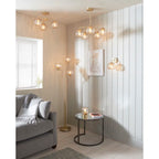 Elegant Litchford 5-light chandelier by TheChandelierCo featuring a modern design with five glass shades and a brushed metal finish.