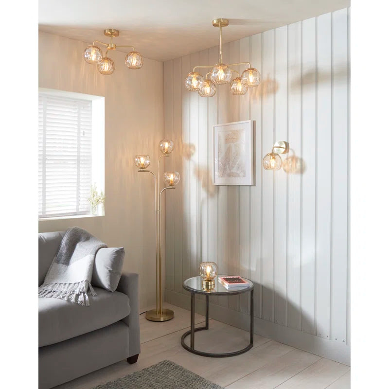 Elegant Litchford 5-light chandelier by TheChandelierCo featuring a modern design with five glass shades and a brushed metal finish.