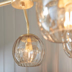 Elegant Litchford 5 light chandelier by TheChandelierCo featuring a modern design with five illuminated glass shades.