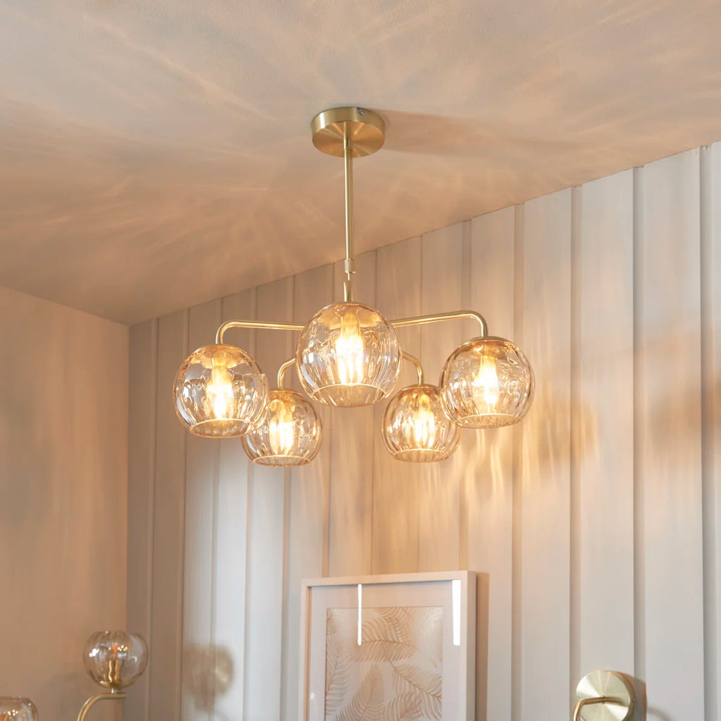 Elegant Litchford 5-light chandelier by TheChandelierCo featuring a modern design with five illuminated bulbs and sleek metal finish.