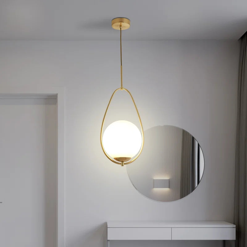 Modern Malchow LED pendant light by TheChandelierCo featuring a sleek, minimalist design with a glowing light fixture.