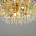 Elegant Mchugh 18 light chandelier by TheChandelierCo with multiple glass shades and a sleek metal frame.