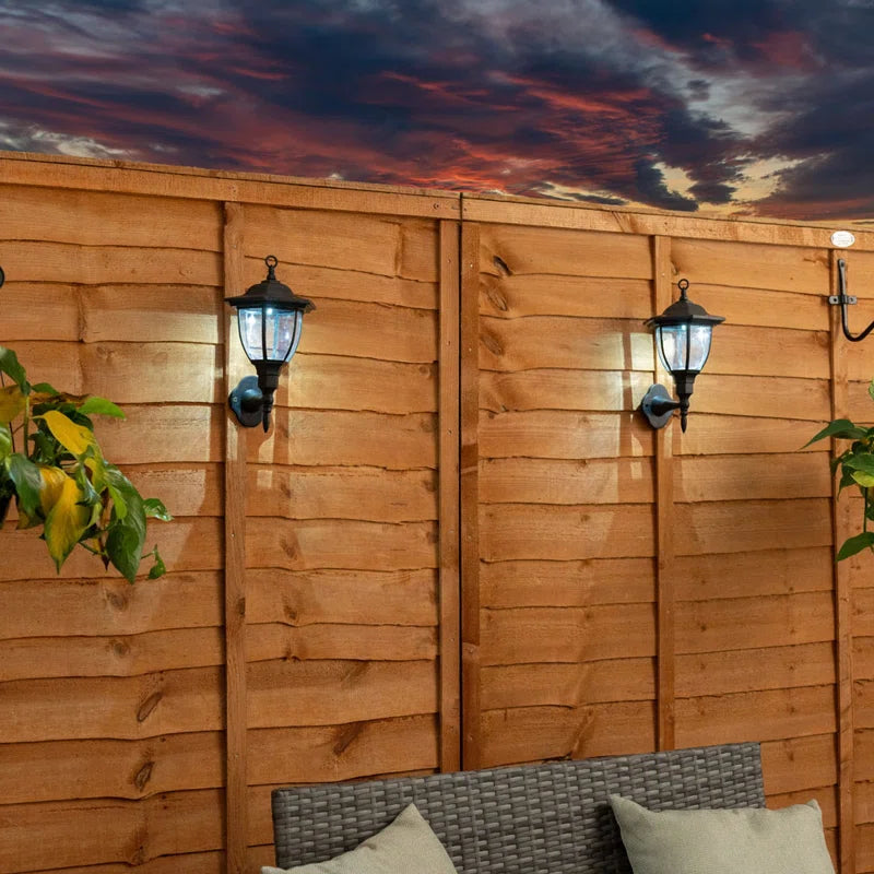 Set of two Midlothian matte black outdoor wall lanterns with integrated LED bulbs, 22cm tall, solar-powered for outdoor lighting.