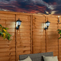 Set of two Midlothian matte black outdoor wall lanterns with integrated LED bulbs, 22cm tall, solar-powered for outdoor lighting.