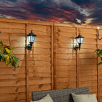 Set of two Midlothian matte black outdoor wall lanterns with integrated LED bulbs, 22cm tall, solar-powered for outdoor lighting.