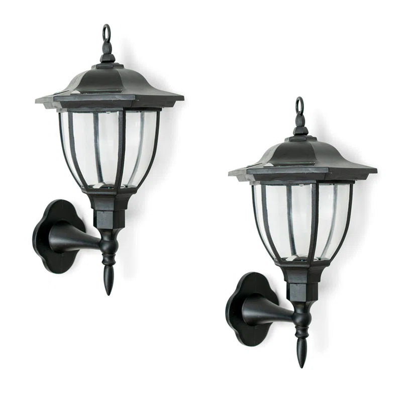 Set of two Midlothian matte black outdoor wall lanterns with integrated LED and solar power, 22cm tall, for exterior lighting.