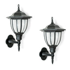 Set of two Midlothian matte black outdoor wall lanterns with integrated LED and solar power, 22cm tall, for exterior lighting.