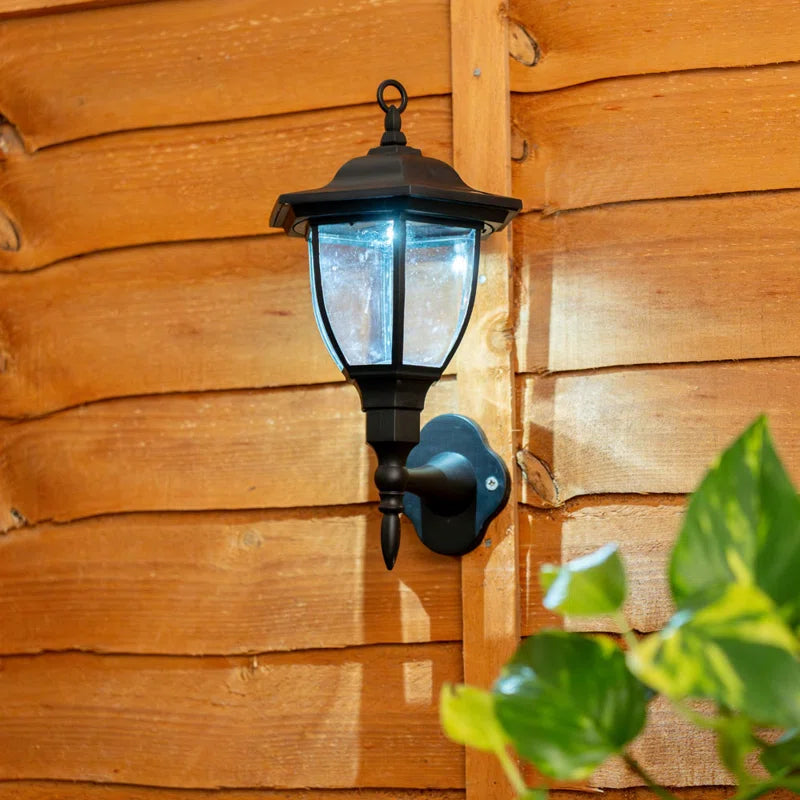 Set of two Midlothian matte black outdoor wall lanterns with integrated LED bulbs, 22cm tall, solar-powered for outdoor lighting.